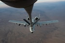 A U.S. Air Force A-10C Thunderbolt II aircraft receives fuel from a KC-135 Stratotanker aircraft assigned to the 74th Expeditionary Air Refueling Squadron during a mission within the U.S. Central Command area of responsibility, Jan. 5, 2026. The A-10 can loiter near battle areas for extended periods of time and operate in low ceiling and visibility conditions. (U.S. Air Force photo by Airman 1st Class Travis Knauss)