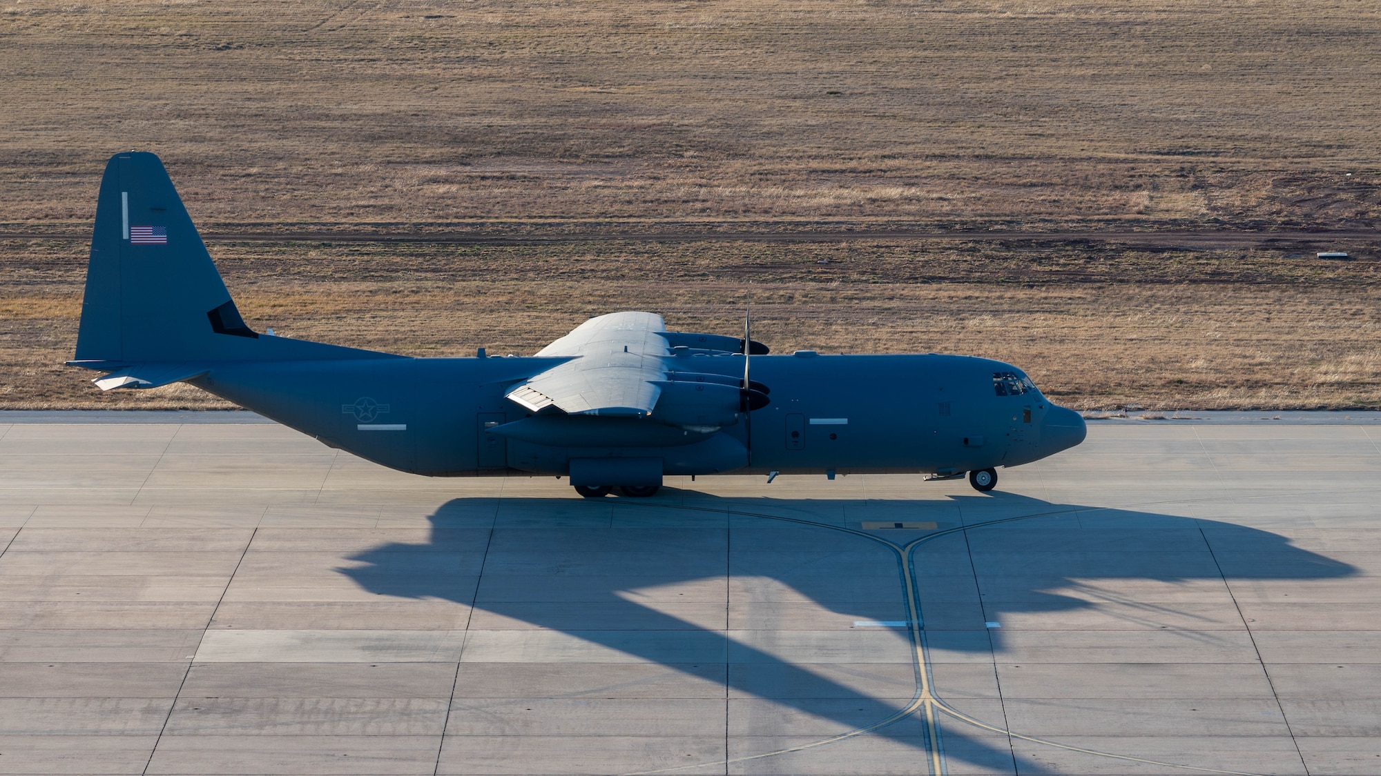 A U.S. Air Force C-130J Super Hercules equipped with external fuel tanks  assigned to the 317th Airlift Wing taxis before departing for a Maximum Endurance Operation at Dyess Air Force Base, Texas, Jan. 12, 2026. The MEO enabled the 317th AW to deliver tactical airlift beyond standard reach by flying a C-130J into the Indo-Pacific with minimal fuel stops. The C-130J, C-17 Globemaster III, and KC-46 Pegasus integrated during Exercise Palmetto Reach to enhance interoperability and readiness for future Indo-Pacific operations. (U.S. Air Force photo by Airman William Neal)