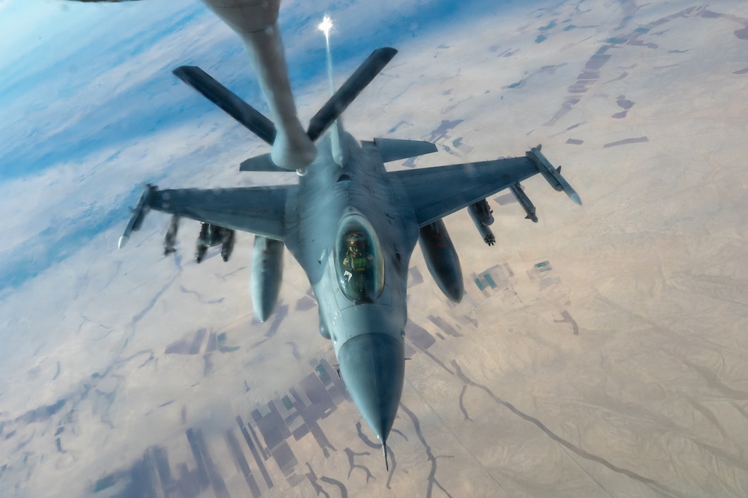 A U.S. Air Force F-16 Fighting Falcon aircraft prepares to receive fuel from a KC-135 Stratotanker aircraft assigned to the 74th Expeditionary Air Refueling Squadron during a mission in the U.S. Central Command area of responsibility, Jan. 5, 2026. The Fighting Falcon demonstrates the U.S. commitment to regional security by providing responsive airpower and deterring potential threats within the USCENTCOM AOR. (U.S. Air Force photo by Airman 1st Class Travis Knauss)
