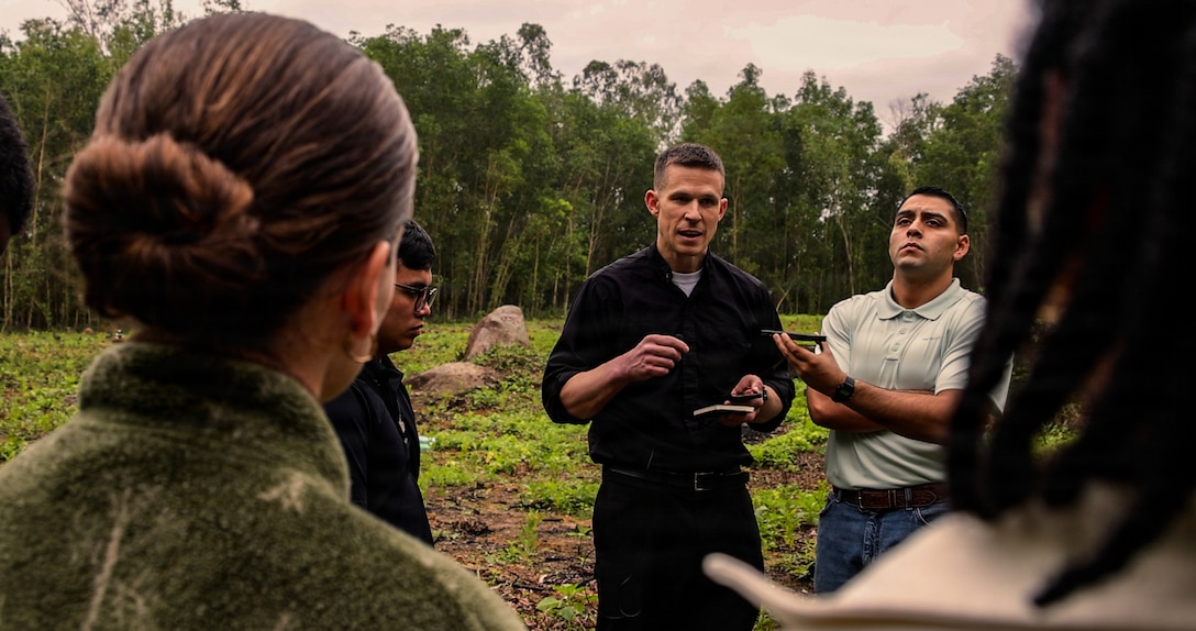 U.S. Marines and Sailors with the 31st Marine Expeditionary Unit, call retired U.S. Marine Corps Cpl. George Phillips during a tour of a battlefield in an area formerly known as the Que Son Valley near Da Nang, Vietnam, Jan. 10, 2026. Marines and Sailors visited this battle site to honor and show reverence for the service members who fought in the Vietnam War. The 31st MEU, the Marine Corps’ only continuously forward-deployed MEU, provides a flexible and lethal force ready to perform a wide range of military operations as the premiere crisis response force in the Indo-Pacific region. (U.S. Marine Corps photo by Lance Cpl. Victor Gurrola)