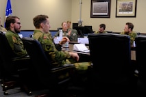 photo US Air Force Airmen and Royal Norwegian Air Force members standing and talking