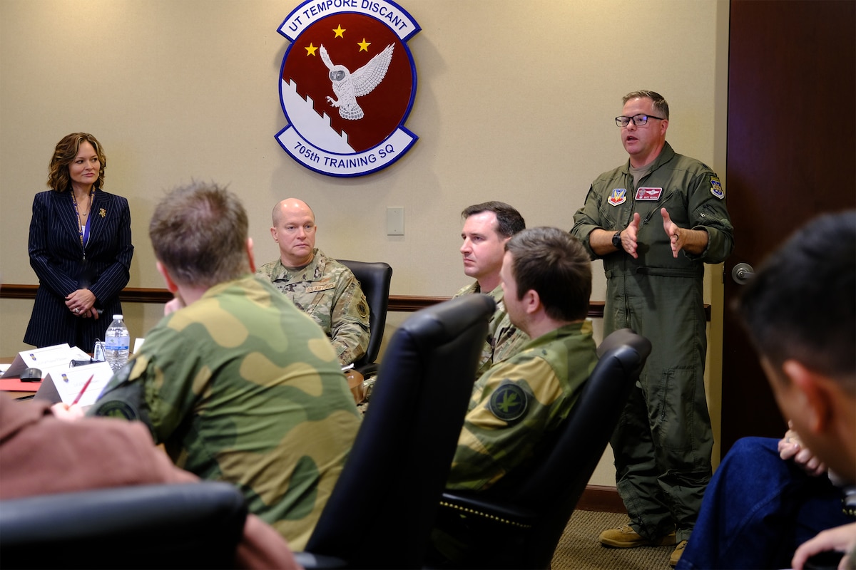 photo US Air Force Airmen and Royal Norwegian Air Force members standing and talking