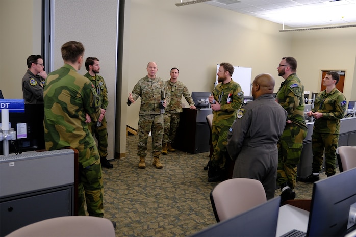photo US Air Force Airmen and Royal Norwegian Air Force members standing and talking
