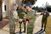 photo US Air Force Airmen and Royal Norwegian Air Force members standing and talking