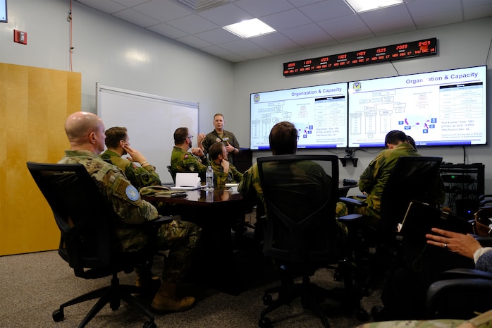 photo US Air Force Airmen and Royal Norwegian Air Force members standing and talking