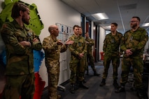 photo US Air Force Airmen and Royal Norwegian Air Force members standing and talking