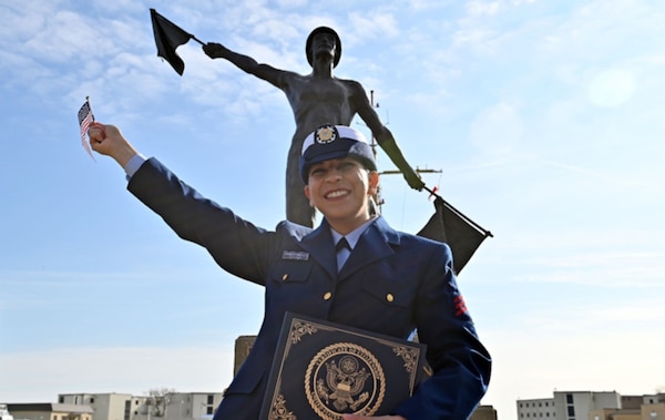 Petty Officer Third Class Melissa Chaparro Santillan holds her certificate of U.S. citizenship at U.S. Coast Guard Training Center (TRACEN) Cape May, December 13, 2024 (U.S. Coast Guard Photo Courtesy of Petty Officer Second Class Christopher Biggs).