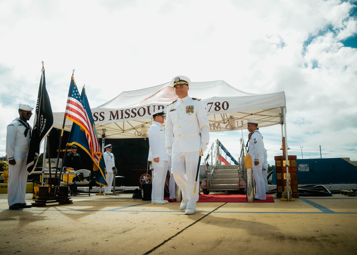 JOINT BASE PEARL HARBOR-HICKAM, Hawaii (Nov. 19, 2025) - Cmdr. Michael Humara, commanding officer of Virginia-class fast-attack submarine USS Missouri (SSN 780), departs the change of command ceremony for Missouri at Joint Base Pearl Harbor-Hickam, Hawaii, Nov. 19, 2025. Missouri is assigned to Submarine Squadron 7 and is capable of supporting various missions, including anti-submarine warfare, anti-surface ship warfare, strike warfare, special operations forces support, and intelligence, surveillance, and reconnaissance. (U.S. Navy photo by Mass Communication Specialist 2nd Class Nicholas Russell)