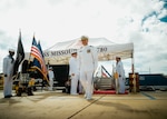 JOINT BASE PEARL HARBOR-HICKAM, Hawaii (Nov. 19, 2025) - Cmdr. Michael Humara, commanding officer of Virginia-class fast-attack submarine USS Missouri (SSN 780), departs the change of command ceremony for Missouri at Joint Base Pearl Harbor-Hickam, Hawaii, Nov. 19, 2025. Missouri is assigned to Submarine Squadron 7 and is capable of supporting various missions, including anti-submarine warfare, anti-surface ship warfare, strike warfare, special operations forces support, and intelligence, surveillance, and reconnaissance. (U.S. Navy photo by Mass Communication Specialist 2nd Class Nicholas Russell)