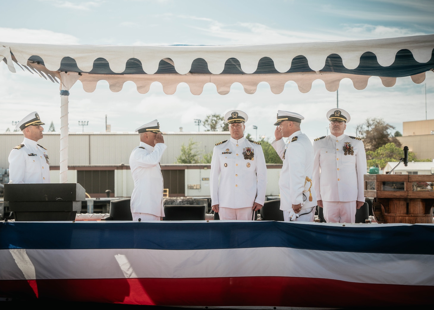 JOINT BASE PEARL HARBOR-HICKAM, Hawaii (Nov. 19, 2025) - Cmdr. Michael Humara, incoming commanding officer of Virginia-class fast-attack submarine USS Missouri (SSN 780), second from right, salutes Cmdr. Gieorag Andrews, outgoing commanding officer of Missouri, second from left, while Capt. Jeffrey Fassbender, commander, Submarine Squadron 7, center, observes during the Missouri’s change of command ceremony on Joint Base Pearl Harbor-Hickam, Hawaii, Nov. 19, 2025. Missouri is assigned to Submarine Squadron 7 and is capable of supporting various missions, including anti-submarine warfare, anti-surface ship warfare, strike warfare, special operations forces support, and intelligence, surveillance, and reconnaissance. (U.S. Navy photo by Mass Communication Specialist 2nd Class Nicholas Russell)