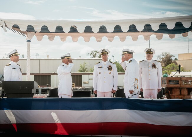 JOINT BASE PEARL HARBOR-HICKAM, Hawaii (Nov. 19, 2025) - Cmdr. Michael Humara, incoming commanding officer of Virginia-class fast-attack submarine USS Missouri (SSN 780), second from right, salutes Cmdr. Gieorag Andrews, outgoing commanding officer of Missouri, second from left, while Capt. Jeffrey Fassbender, commander, Submarine Squadron 7, center, observes during the Missouri’s change of command ceremony on Joint Base Pearl Harbor-Hickam, Hawaii, Nov. 19, 2025. Missouri is assigned to Submarine Squadron 7 and is capable of supporting various missions, including anti-submarine warfare, anti-surface ship warfare, strike warfare, special operations forces support, and intelligence, surveillance, and reconnaissance. (U.S. Navy photo by Mass Communication Specialist 2nd Class Nicholas Russell)