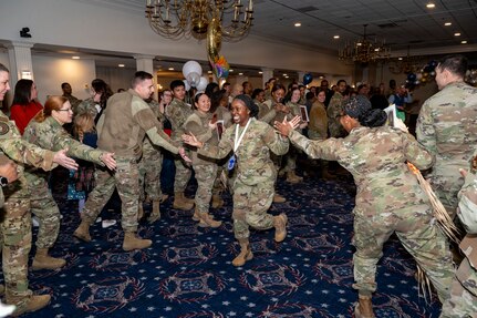 Senior Master Sgt. Kristen Brown, Headquarters Air Force Air Force Logistics Readiness Office, hi-fives service members during a chief master sergeant release party at Joint Base Anacostia-Bolling, Washington, D.C., Jan. 15, 2026. In 2026, Air Force officials selected 640 senior master sergeants for promotion out of 2,445 eligible candidates for a selection rate of 26.18%. (U.S. Air Force photo by Hayden Hallman)