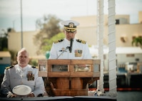 JOINT BASE PEARL HARBOR-HICKAM, Hawaii (Nov. 19, 2025) - Cmdr. Gieorag Andrews, outgoing commanding officer of Virginia-class fast-attack submarine USS Missouri (SSN 780), gives remarks during the change of command ceremony for Missouri at Joint Base Pearl Harbor-Hickam, Hawaii, Nov. 19, 2025. Missouri is assigned to Submarine Squadron 7 and is capable of supporting various missions, including anti-submarine warfare, anti-surface ship warfare, strike warfare, special operations forces support, and intelligence, surveillance, and reconnaissance. (U.S. Navy photo by Mass Communication Specialist 2nd Class Nicholas Russell)