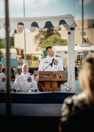 JOINT BASE PEARL HARBOR-HICKAM, Hawaii (Nov. 19, 2025) - Capt. Jeffrey Fassbender, commander, Submarine Squadron 7, gives remarks during the change of command ceremony for Virginia-class fast-attack submarine USS Missouri (SSN 780) at Joint Base Pearl Harbor-Hickam, Hawaii, Nov. 19, 2025. Missouri is assigned to Submarine Squadron 7 and is capable of supporting various missions, including anti-submarine warfare, anti-surface ship warfare, strike warfare, special operations forces support, and intelligence, surveillance, and reconnaissance. (U.S. Navy photo by Mass Communication Specialist 2nd Class Nicholas Russell)