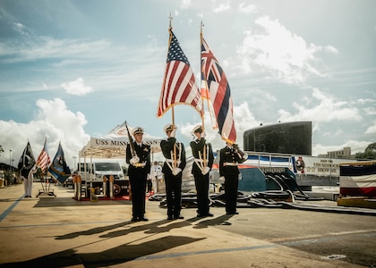 JOINT BASE PEARL HARBOR-HICKAM, Hawaii (Nov. 19, 2025) – Members of Admiral Arthur W. Radford High School Naval Junior Reserve Officer Training Corps color guard present the colors during a change of command ceremony for Virginia-class fast-attack submarine USS Missouri (SSN 780) at Joint Base Pearl Harbor-Hickam, Hawaii, Nov. 19, 2025. Missouri is assigned to Submarine Squadron 7 and is capable of supporting various missions, including anti-submarine warfare, anti-surface ship warfare, strike warfare, special operations forces support, and intelligence, surveillance, and reconnaissance. (U.S. Navy photo by Mass Communication Specialist 2nd Class Nicholas Russell)