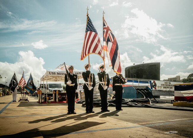 JOINT BASE PEARL HARBOR-HICKAM, Hawaii (Nov. 19, 2025) – Members of Admiral Arthur W. Radford High School Naval Junior Reserve Officer Training Corps color guard present the colors during a change of command ceremony for Virginia-class fast-attack submarine USS Missouri (SSN 780) at Joint Base Pearl Harbor-Hickam, Hawaii, Nov. 19, 2025. Missouri is assigned to Submarine Squadron 7 and is capable of supporting various missions, including anti-submarine warfare, anti-surface ship warfare, strike warfare, special operations forces support, and intelligence, surveillance, and reconnaissance. (U.S. Navy photo by Mass Communication Specialist 2nd Class Nicholas Russell)