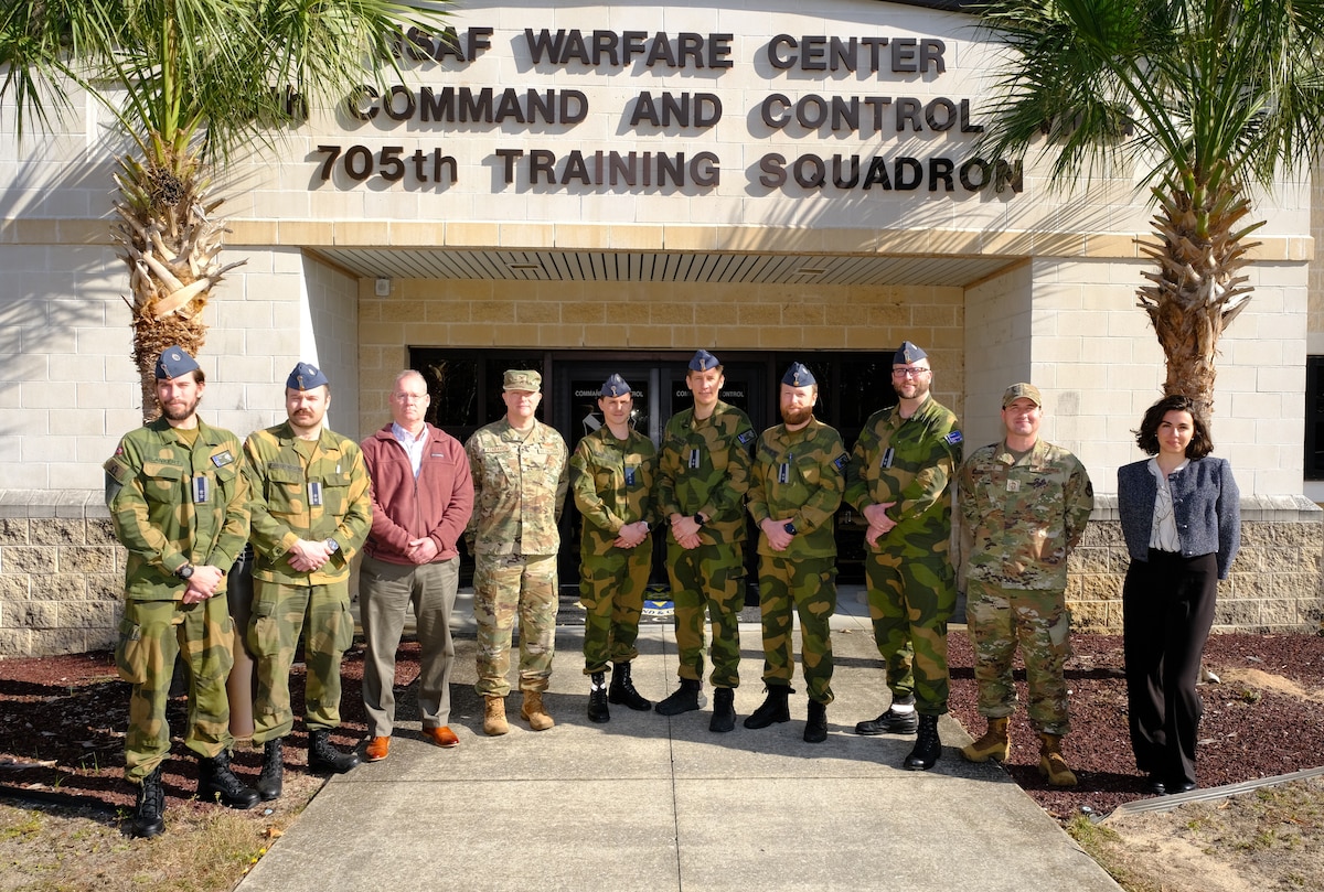 photo US Air Force Airmen and Royal Norwegian Air Force members standing and talking