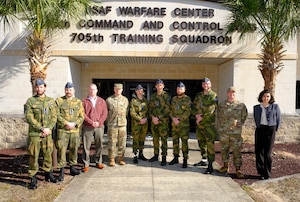 photo US Air Force Airmen and Royal Norwegian Air Force members standing and talking