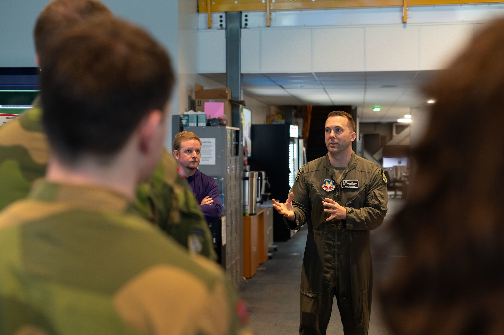 photo US Air Force Airmen and Royal Norwegian Air Force members standing and talking