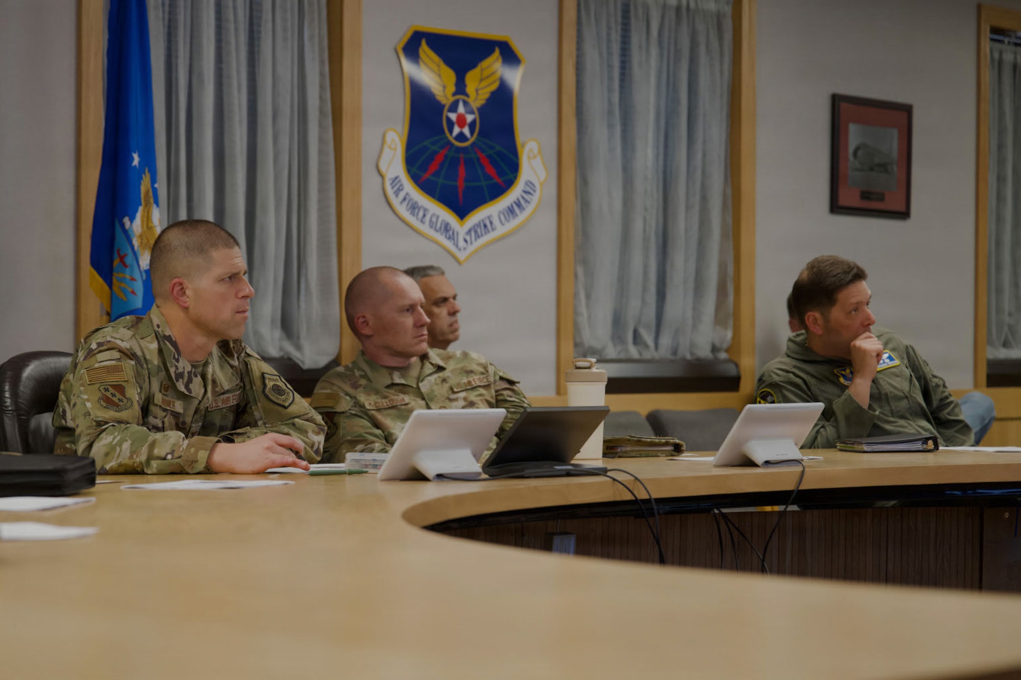 U.S. Air Force Col. Seth Spanier, 7th Bomb Wing commander, and Chief Master Sgt. Benjamin McCollough, 7th BW command chief, attend the B-21 Nuclear Summit out brief at Dyess Air Force Base, Texas, Jan. 15, 2026. The briefing highlighted planning efforts to transition Dyess into the next generation of precision strike aircraft. (U.S. Air Force photo by Senior Airman Emma Anderson)