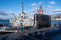 Sailors from the Virginia-class attack submarine USS Texas (SSN 775) pull in line from a tugboat as the submarine prepares to depart Portsmouth Naval Shipyard in Kittery, Maine, to conduct sea trials after receiving critical repairs and system upgrades vital to extending the submarine’s service life and ensuring the Navy’s long-term fleet readiness, Dec. 6, 2024.