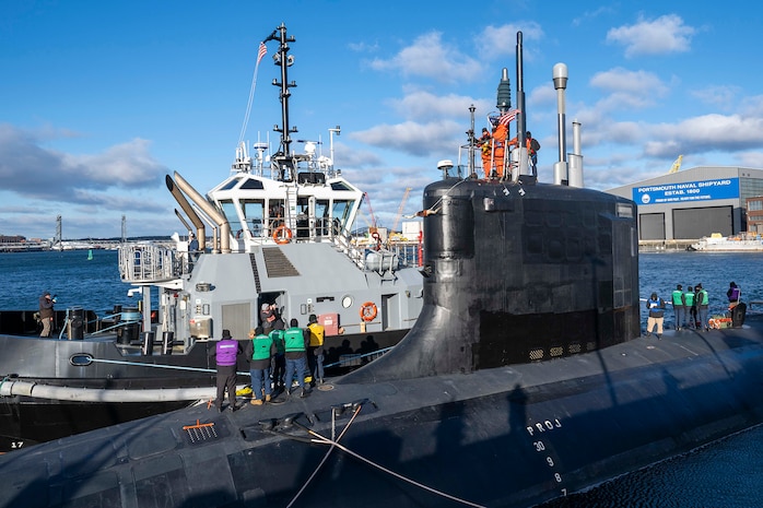 Sailors from the Virginia-class attack submarine USS Texas (SSN 775) pull in line from a tugboat as the submarine prepares to depart Portsmouth Naval Shipyard in Kittery, Maine, to conduct sea trials after receiving critical repairs and system upgrades vital to extending the submarine’s service life and ensuring the Navy’s long-term fleet readiness, Dec. 6, 2024.