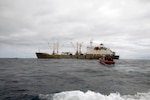 U.S. Coast Guard members conduct a boarding of a fishing vessel in the Eastern Pacific, August 3, 2022.