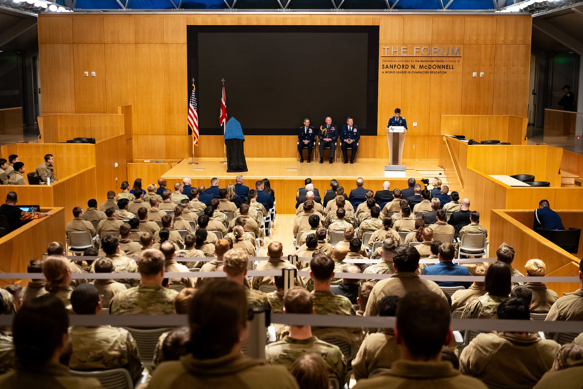 Photo of U.S. Air Force Cadet 1st Class Jack Marsh on stage, addressing an audience