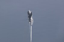 An F/A-18E Super Hornet, attached to Strike Fighter Squadron (VFA) 151, flies over Nimitz-class aircraft carrier USS Abraham Lincoln (CVN 72) on Jan. 15, 2026.