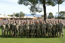 Chief of Space Operations Gen. Chance Saltzman, center-left, and U.S. Space Forces Southern Commander Col. Brandon Alford, center-right, pose for a group photo with Guardians at Davis-Monthan Air Force Base, Arizona, Jan. 21, 2026. The activation of SPACEFOR–SOUTH marks another significant step in formally establishing space as a warfighting domain critical to joint operations, reinforcing security and stability across the Western Hemisphere. (U.S. Air Force photo by Tech. Sgt. Rachel Maxwell)