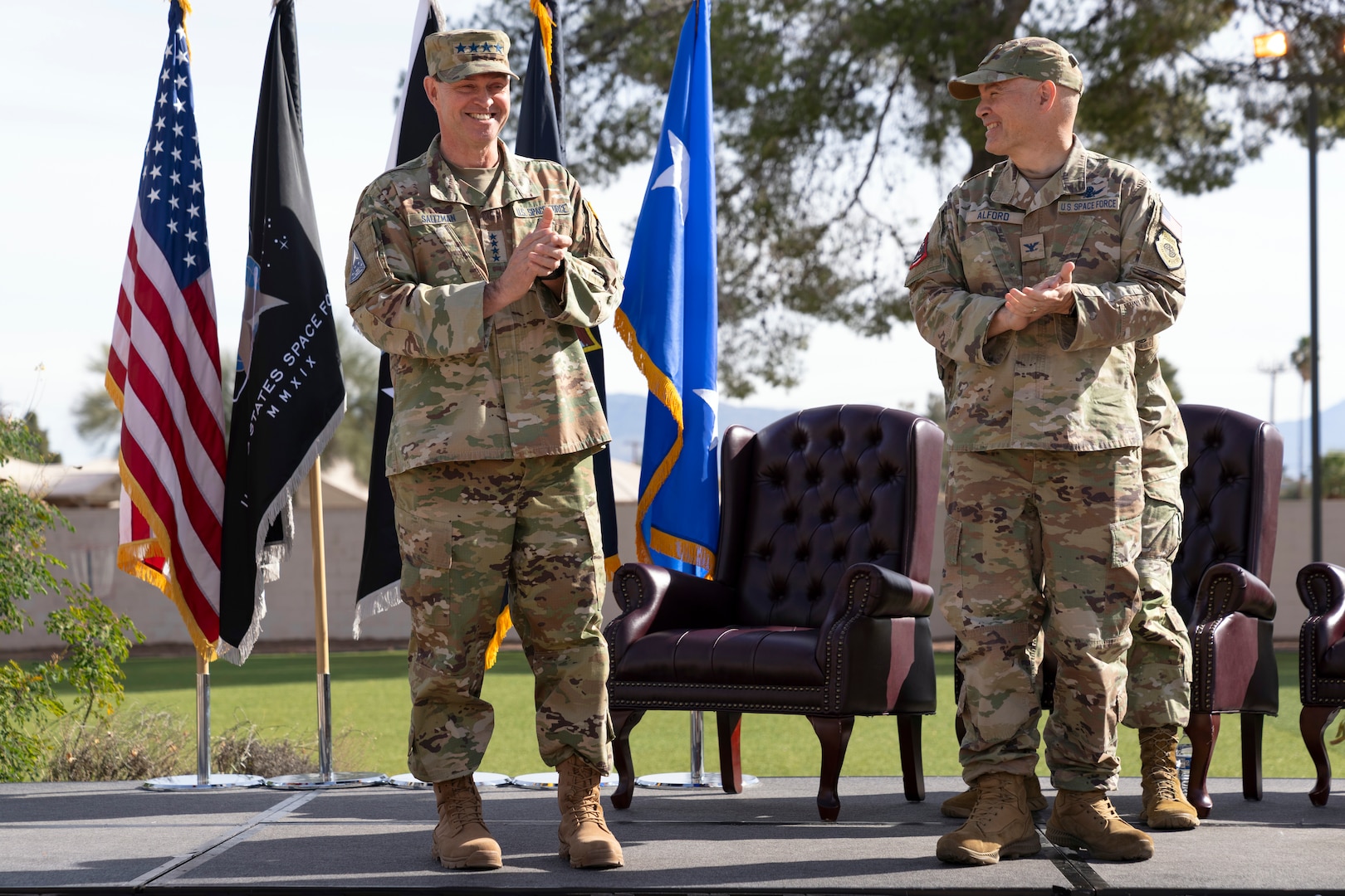 Chief of Space Operations Gen. Chance Saltzman, left, and U.S. Space Forces Southern Commander Col. Brandon Alford, right, applaud after officially activating SPACEFOR-SOUTH at Davis-Monthan Air Force Base, Arizona, Jan. 21, 2026. SPACEFOR–SOUTH became operational effective Dec. 1, 2025, the ceremony formally recognized the activation with the assumption of command by Alford, and the digital unveiling of the Space Forces Southern emblem, symbolizing the command’s mission and regional focus. (U.S. Air Force photo by Tech. Sgt. Rachel Maxwell)