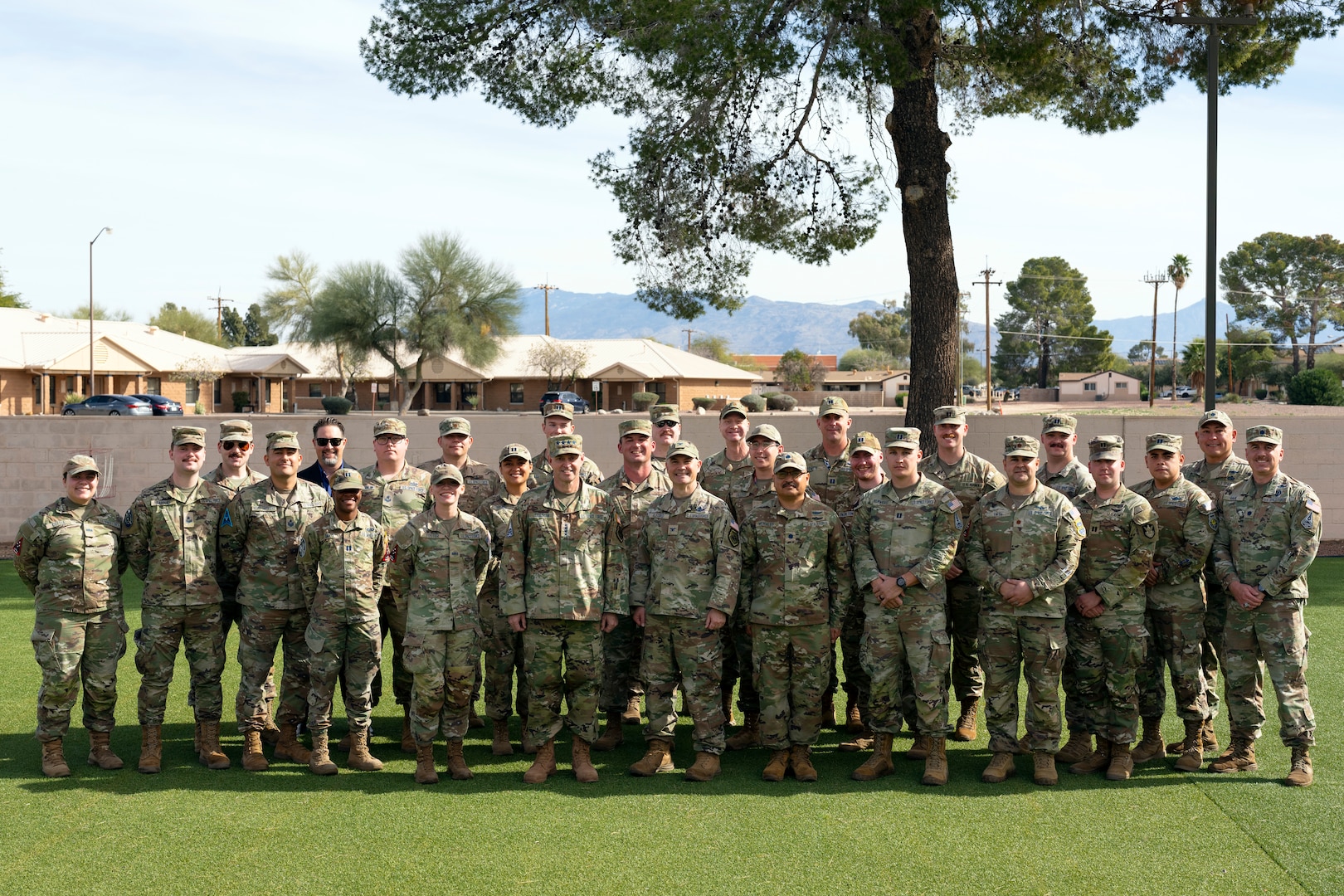 Chief of Space Operations Gen. Chance Saltzman, center-left, and U.S. Space Forces Southern Commander Col. Brandon Alford, center-right, pose for a group photo with Guardians at Davis-Monthan Air Force Base, Arizona, Jan. 21, 2026. The activation of SPACEFOR–SOUTH marks another significant step in formally establishing space as a warfighting domain critical to joint operations, reinforcing security and stability across the Western Hemisphere. (U.S. Air Force photo by Tech. Sgt. Rachel Maxwell)