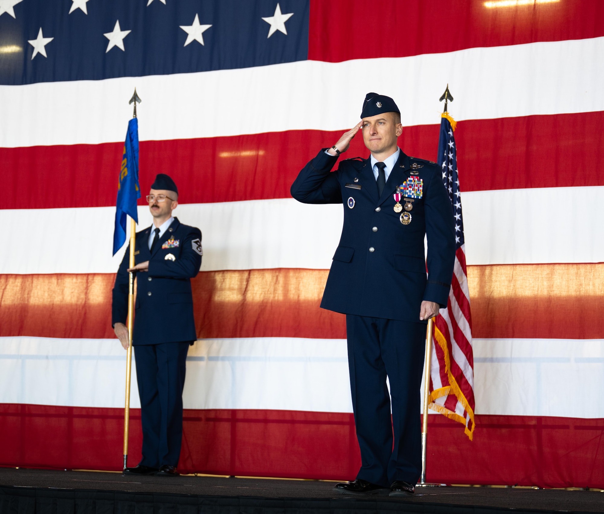 Lt. Col. Daniel Garrison, 47th Operations Support Squadron (OSS) outgoing commander, renders his final salute to Airmen of the 47th OSS during the change of command ceremony at Laughlin Air Force Base, Texas, Jan. 16, 2026. The change of command ceremony is a tradition dating back to the Roman era, where military leaders would pass batons, colors, standards, or ensigns that symbolized the passing of command to subordinates in attendance and ensured unit members were never without official leadership or a continuation of trust.(U.S. Air Force photo by Airman 1st Class Harrison Sullivan)