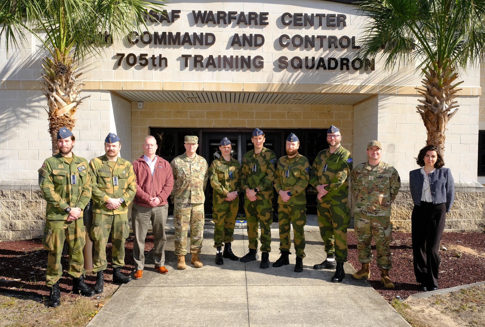 photo US Air Force Airmen and Royal Norwegian Air Force members standing and talking