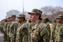 Female Air Force Servicemember poses in formation with others