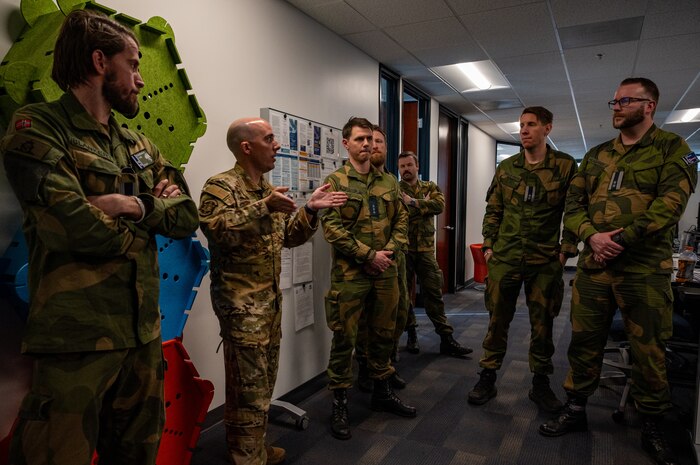 photo US Air Force Airmen and Royal Norwegian Air Force members standing and talking