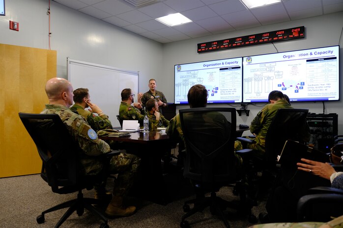 photo US Air Force Airmen and Royal Norwegian Air Force members standing and talking