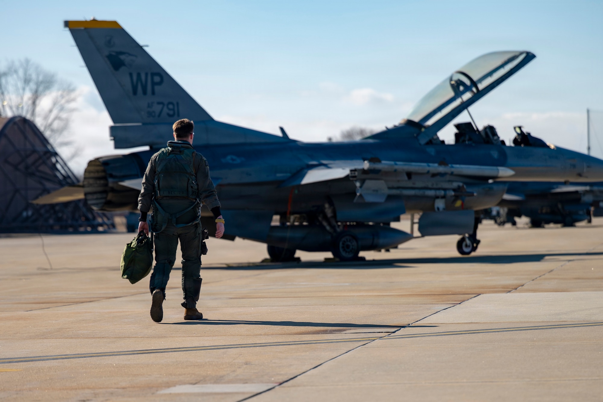 U.S. Air Force Capt. Griffin Line, 35th Fighter Squadron F-16 Fighting Falcon pilot, walks to an F-16 to conduct a training flight at Osan Air Base, Republic of Korea, Jan. 21, 2026.