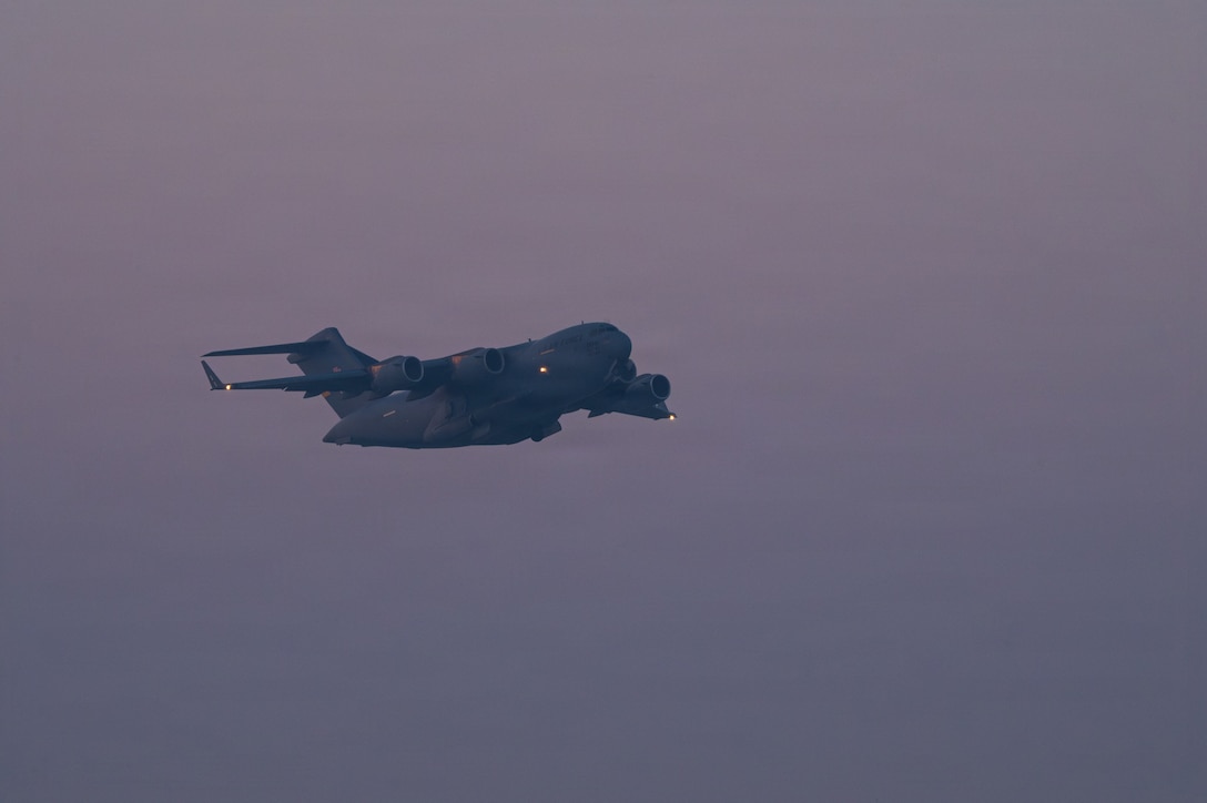 A U.S. Air Force C-17 Globemaster III aircraft takes off in support of a readiness exercise within the U.S. Central Command area of responsibility, Jan. 21, 2026. The exercise was designed to strengthen 9th Air Force’s ability to disperse combat airpower throughout the CENTCOM AOR, adding strategic ambiguity to adversary decision-making. (U.S. Air Force photo by Senior Airman Joseph Garcia)