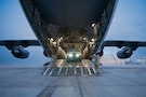 U.S. Air Force Airman 1st Class Jansy Pedrosa-Cruz, 16th Expeditionary Airlift Squadron load master, ­­­­­­­directs the loading of a Humvee onto a C-17 Globemaster III aircraft during a mission in the U.S. Central Command area of responsibility, Dec. 20, 2025. Loadmasters assigned to the 16th EAS are responsible for supervising the loading, securing and unloading of cargo, vehicles and personnel. (U.S. Air Force photo by Airman 1st Class Travis Knauss)