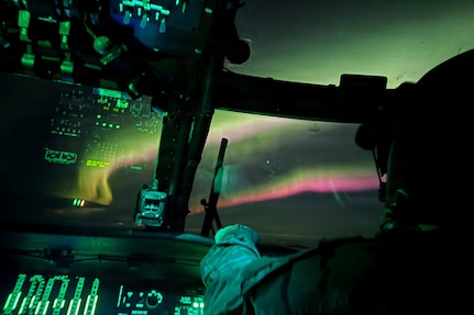 Bethel-based U.S. Army UH-60L Black Hawk aviators assigned to the 207th Aviation Troop Command, Alaska Army National Guard, fly under the Northern Lights while responding to a medical evacuation request in Western Alaska, Jan. 21, 2026.