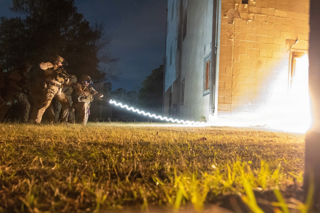 U.S. Reconnaissance Marines, with the 24th Marine Expeditionary Unit (MEU), detonate an explosive charge to breach a door during Close Quarters Tactics training on Stone Bay, Camp Lejeune, North Carolina, on December 11, 2025. The 24th MEU is a Marine Air-Ground Task Force ready to answer the nation's call in any clime and place.  (U.S. Marine Corps photo by Cpl. Daniel R. Garcia)