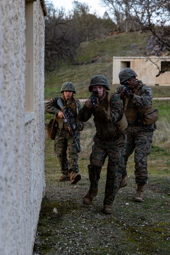 U.S. Marines clear a building during a Cold Weather Field Exercise at Fort Hunter-Liggett, Calif. on Jan. 10th, 2026. The Marines are a part of Combat Logistics Battalion 23, 4th Marine Logistics Group. CLB-23 conducted a hike to transfer from one training area to another, designed to enhance and test readiness and lethality in the Marine Corps Reserve. (U.S Marine Corps photo by Sgt. Eduardo Delatorre)