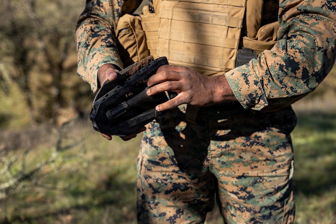 U.S. Marine Corps Cpl. Mekhi Countee, a motor vehicle operator, digs a hole during a Cold Weather Field Exercise at Fort Hunter-Liggett, Calif. on Jan. 10th, 2026. Countee is a part of Combat Logistics Battalion 23, 4th Marine Logistics Group. CLB-23 conducted a hike to transfer from one training area to another, designed to enhance and test readiness and lethality in the Marine Corps Reserve. Countee is a native of California. (U.S Marine Corps photo by Sgt. Eduardo Delatorre)