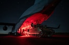 U.S. Airmen and Soldiers load a U.S. Army M2A3 Bradley tank onto a U.S. Air Force C-17 Globemaster III aircraft during an airbridge operation in the U.S. Central Command area of responsibility, Nov. 19, 2025. The 16th Expeditionary Airlift Squadron provided the aerial component of the airbridge operation for the U.S. Army’s 278th Armored Cavalry Regiment, 3rd Squadron, to transport the M2A3 Bradley and U.S. Soldiers. (U.S. Air Force photo by Tech. Sgt. Bailee A. Darbasie)