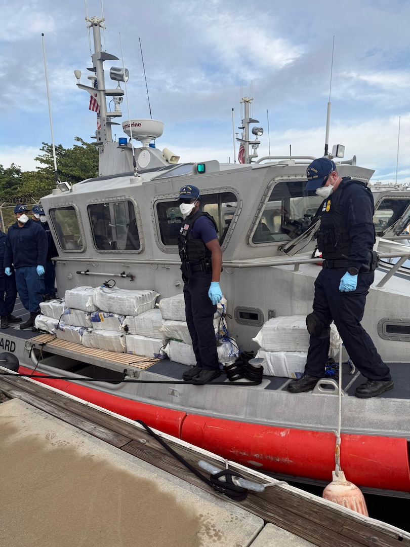 A Coast Guard Station San Juan boat crew and Homeland Security Task Force - San Juan Region partner agencies completed the custody transfer of three apprehended smugglers and the offload of sixteen bales of cocaine which weighed 506kgs/1,115.54 pounds which were valued at more than $7 million.  The apprehension and seizure followed the interdiction of a drug smuggling vessel in Atlantic Ocean waters north of Puerto Rico, Jan. 14, 2026. (U.S. Coast Guard photo)