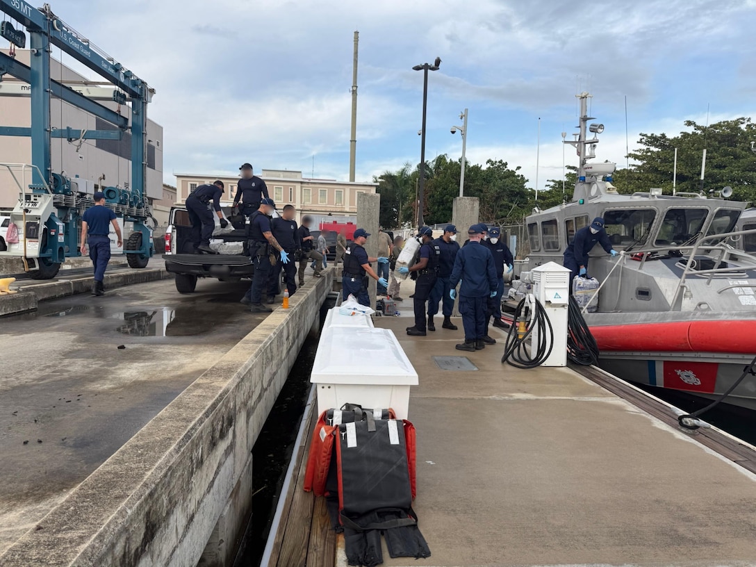 A Coast Guard Station San Juan boat crew and Homeland Security Task Force - San Juan Region partner agencies completed the custody transfer of three apprehended smugglers and the offload of sixteen bales of cocaine which weighed 506kgs/1,115.54 pounds which were valued at more than $7 million.  The apprehension and seizure followed the interdiction of a drug smuggling vessel in Atlantic Ocean waters north of Puerto Rico, Jan. 14, 2026. (U.S. Coast Guard photo)