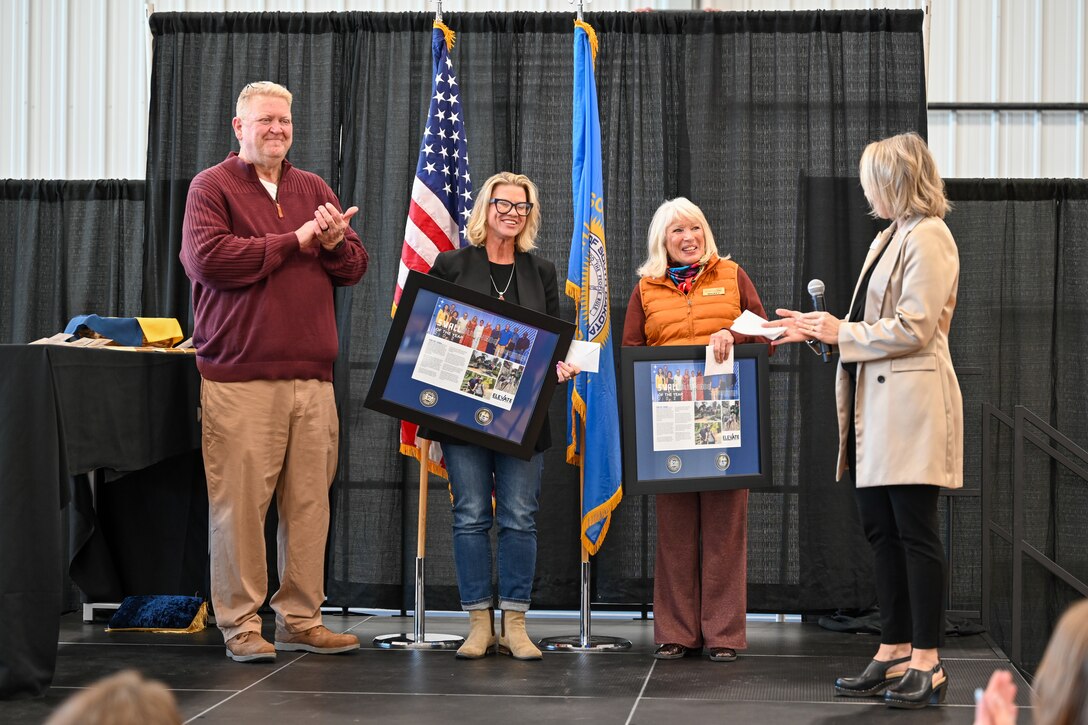 The owners of Black Hills Adventure Tours receive awards for their outstanding efforts.