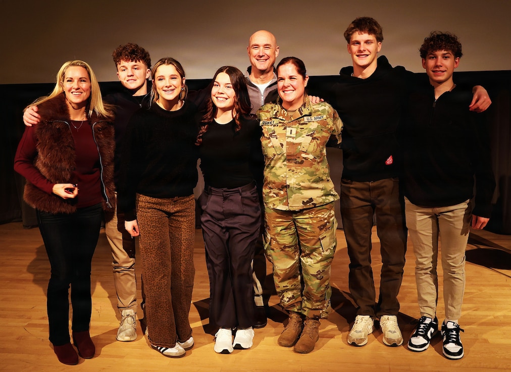 Illinois Army National Guard Chief Warrant Officer 4 Melissa Downey is shown with her family after her promotion.