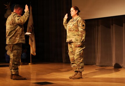 Illinois Army National Guard Chief Warrant Officer 4 Melissa Downey takes the oath of office during her promotion ceremony.